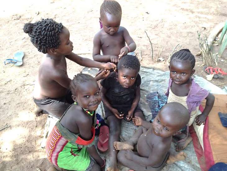 South Sudan children sitting on ground